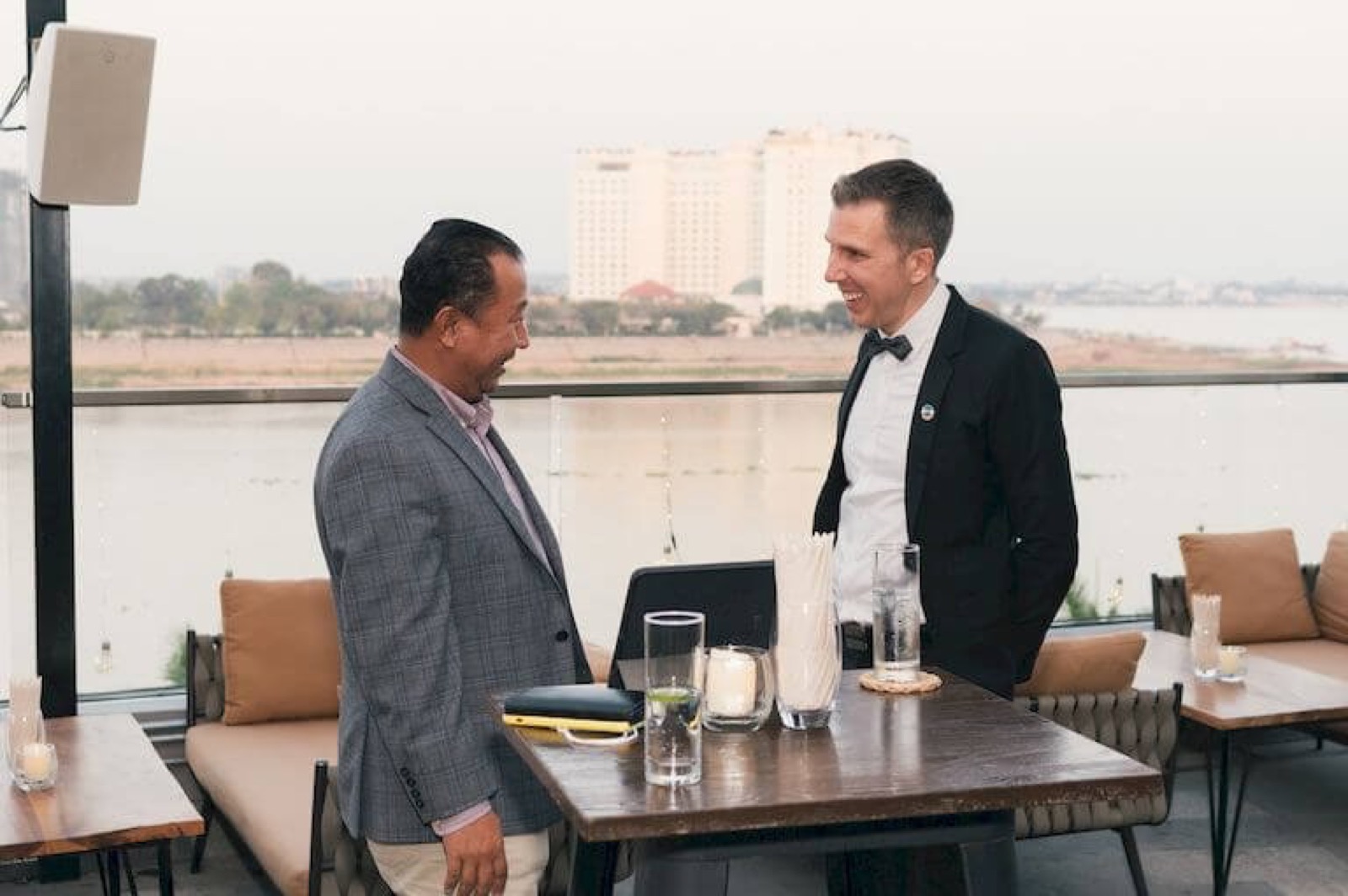 Two members on a rooftop at an AmCham Cambodia construction night
