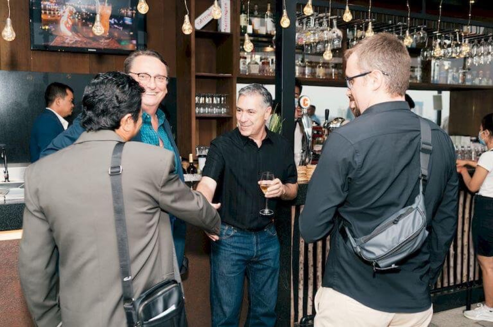 Members in conversation at an AmCham Cambodia construction night