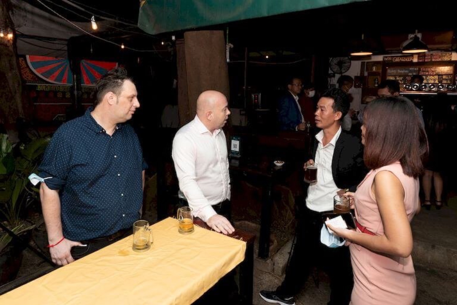 Members around a table at an AmCham Cambodia networking evening