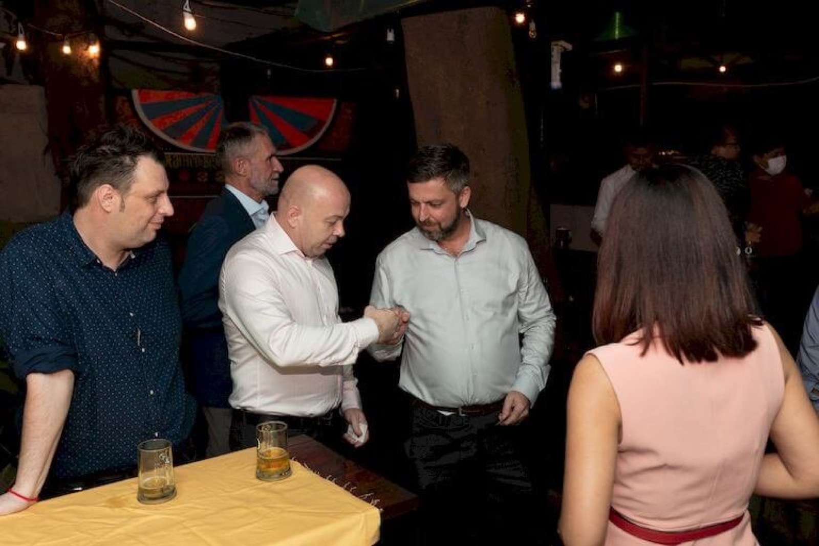 A group in conversation at an AmCham Cambodia networking evening
